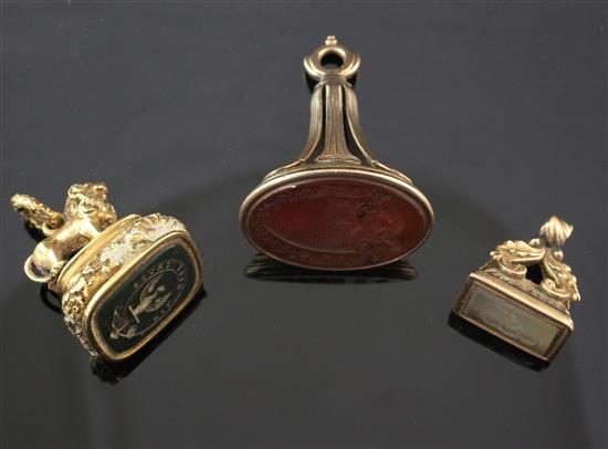 Three Victorian carnelian and gold overlaid seals, largest 1.5in.